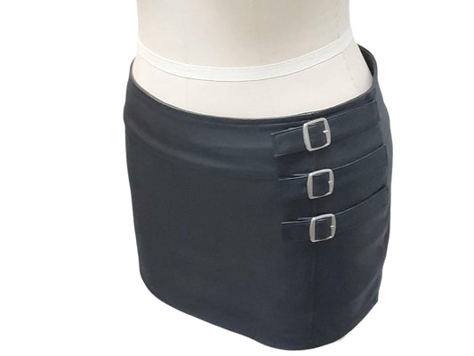 Hand-made lamb leather mini skirt in black. Luxurious, soft, and fully lined with 3 decorative front buckles & a rear zipper. Luxury leather