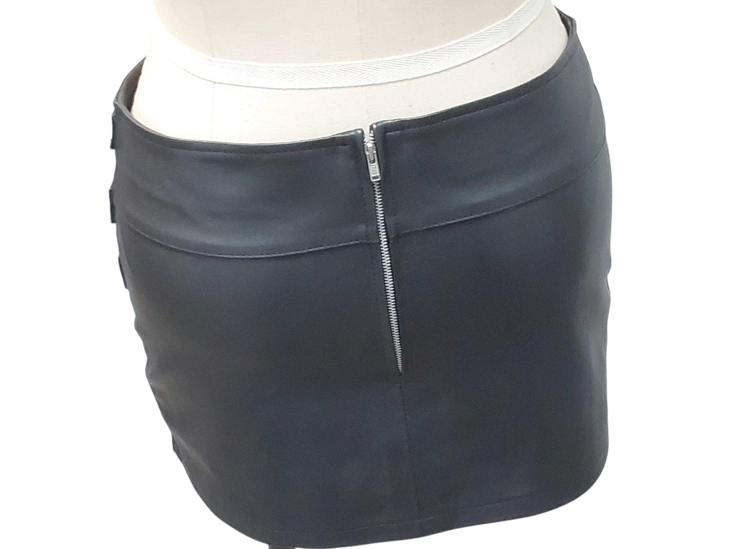 Hand-made lamb leather mini skirt in black. Luxurious, soft, and fully lined with 3 decorative front buckles & a rear zipper. Luxury leather