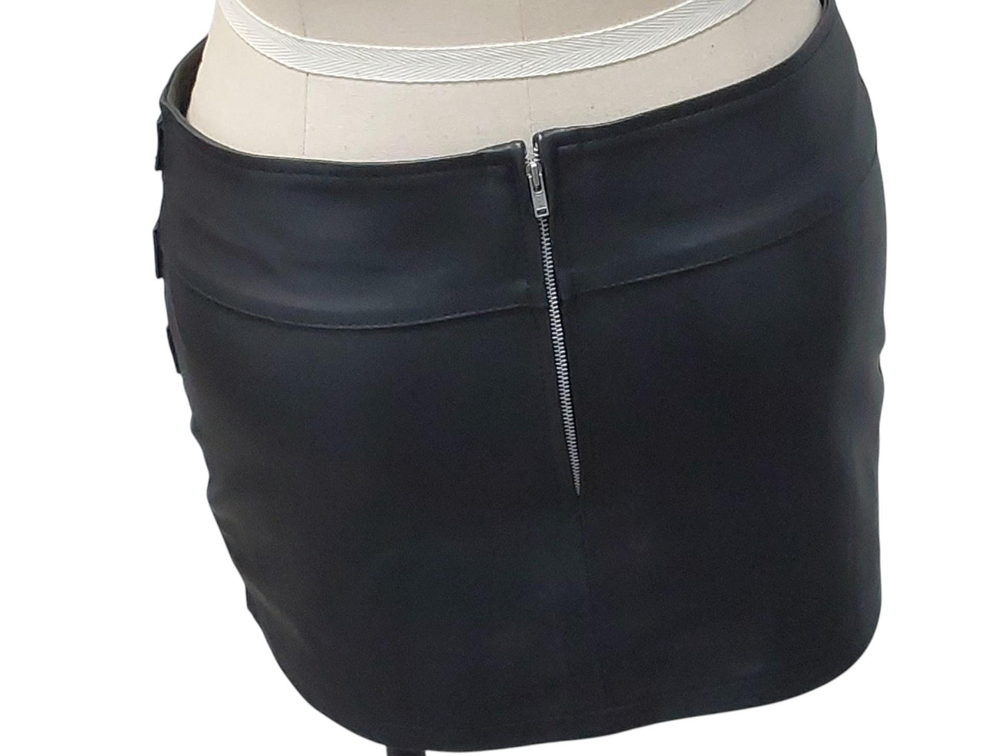 Hand-made lamb leather mini skirt in black. Luxurious, soft, and fully lined with 3 decorative front buckles & a rear zipper. Luxury leather